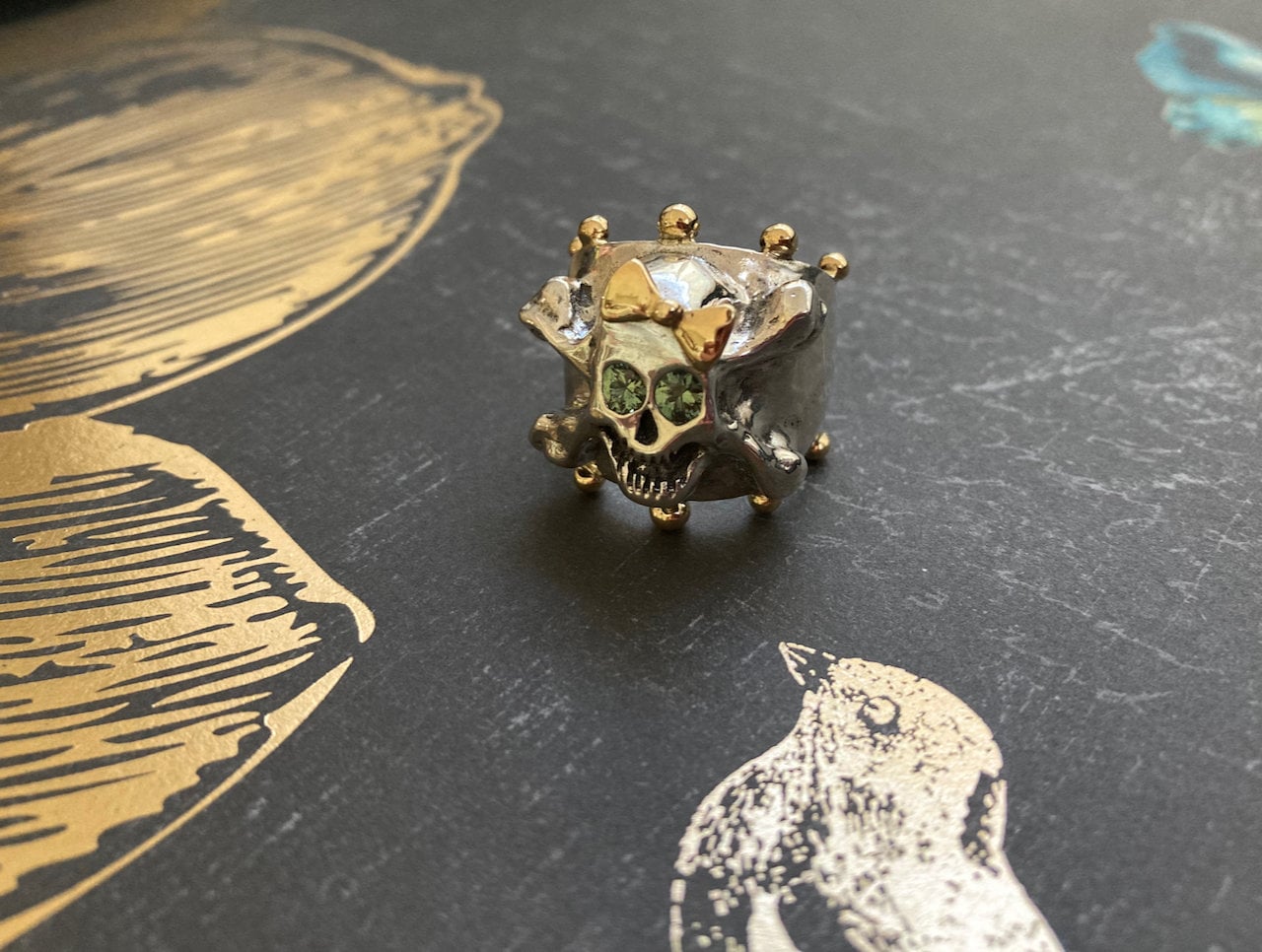 Hello Skully Skull Ring with 18k Gold Bow and Accents, Green Sapphire Eyes