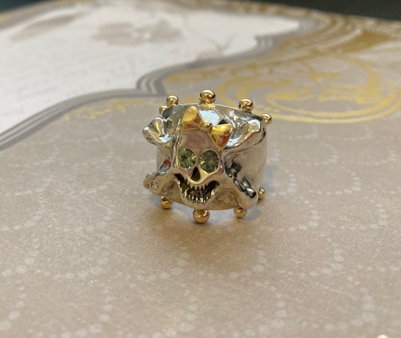 Hello Skully Skull Ring with 18k Gold Bow and Accents, Green Sapphire Eyes